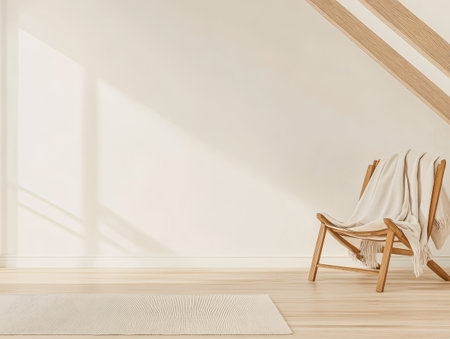 A serene corner of a room features a wooden chair draped with a soft blanket accompanied by a light-colored rug. Warm sunlight filters through creating a peaceful atmosphere.の素材