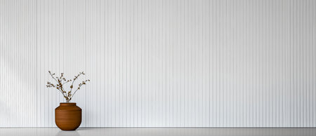 A minimalist interior features a brown pottery vase with delicate branches placed on a smooth surface complemented by a white textured wall. The setting emphasizes tranquility and simplicity.の素材