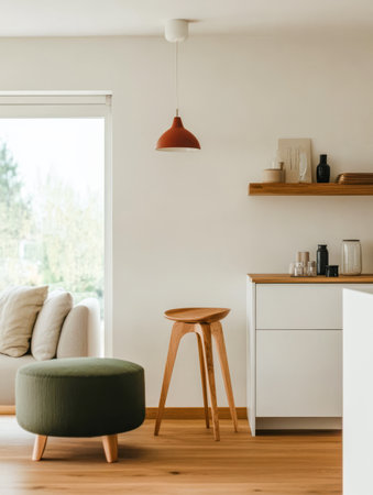 Bright and airy living space featuring a comfortable couch and chic furniture. A pendant light hangs over a wooden table creating a welcoming atmosphere with natural elements.の素材