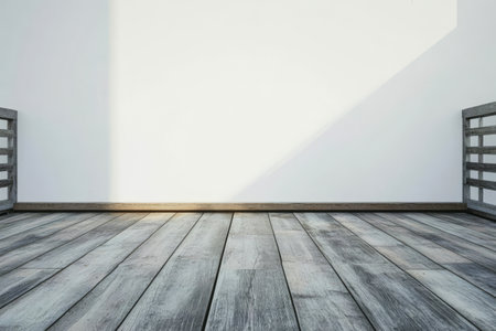 A minimalistic room features white walls and wooden flooring illuminated by daylight. The space is calm and uncluttered ideal for various creative activities or relaxation.の素材