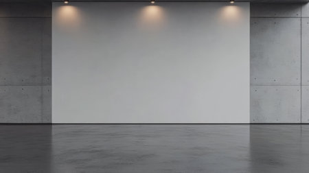 A spacious gallery with a smooth concrete floor and minimalist design. Soft lighting highlights a large empty wall creating a perfect backdrop for art exhibitions or installations.の素材