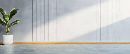 A light and airy interior space features a textured gray wall with vertical lines a potted green plant in a white container and rich wooden flooring bathed in sunlight.の素材