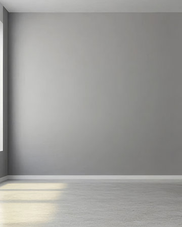 A spacious room features soft gray walls and smooth flooring. Natural light filters in through a window creating a calm inviting atmosphere perfect for various activities.の素材