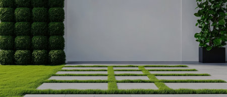 A clean and minimalistic garden area showcasing a stone pathway surrounded by fresh green grass. Tall hedges provide privacy and an inviting atmosphere in a contemporary urban environment.の素材