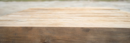 The wooden table surface reveals an intricate texture under bright daylight surrounded by a blurred outdoor backdrop. This setting captures the essence of nature and craftsmanship.の素材