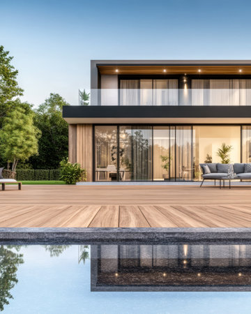 A stylish modern house stands beside a calm swimming pool reflecting its sleek design. Large windows illuminate the interior revealing a comfortable outdoor seating area.の素材