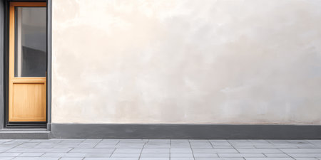 A wooden door stands prominently against a smooth light-colored wall with a clean tiled floor. The setting is minimal and modern showcasing a serene urban atmosphere.の素材