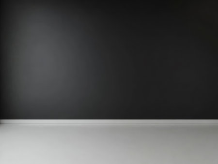 A spacious interior features a black wall on one side and a clean white floor. This versatile area is perfect for activities such as art installations yoga classes or minimalist designs.の素材