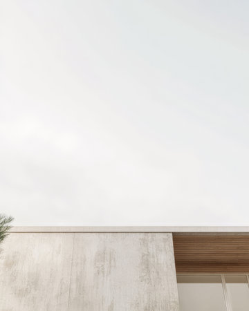 A sleek modern building features clean lines and a smooth facade set against a cloudy sky. The structure emphasizes natural elements and minimalism in its design.の素材