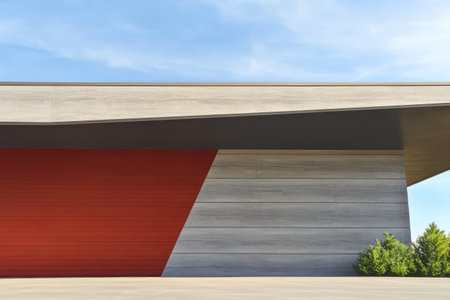 A contemporary building showcases a unique blend of smooth concrete and vibrant red accents. Green shrubs provide a contrast, enhancing the modern aesthetic in an urban environment.の素材