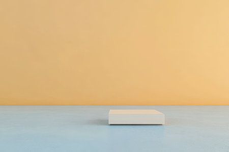 A white pedestal rests on an expansive blue floor, set against a smooth yellow wall. The simple arrangement highlights the clean lines and minimal aesthetic of the space.の素材