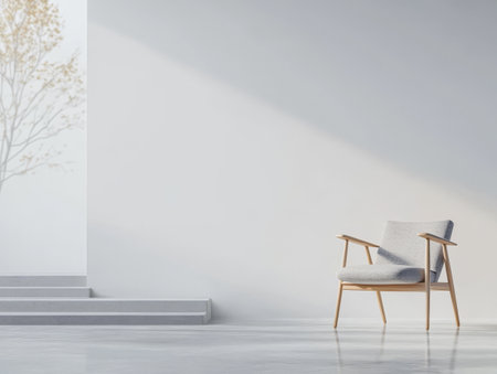 A gray upholstered chair with wooden arms stands alone in a bright minimalist space. Sunlight casts gentle shadows, enhancing the serene atmosphere and clean lines of the setting.の素材