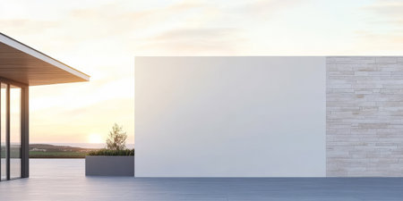 A modern structure features a minimalist facade with a white wall and a stone surface.の素材