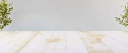 A bright wooden table is adorned with two lush green plants on either side, creating a serene and inviting atmosphere. The light background enhances the overall calming effect.の素材