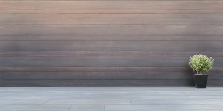 A stylish outdoor space features a sleek wooden wall and a small potted plant on a contemporary patio floor. The design emphasizes simplicity and elegance in framing the natural elements.の素材