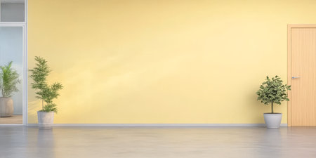 A spacious room features a vibrant yellow wall, enhancing the natural light. Two potted plants sit on the floor, adding greenery and life to the contemporary setting.の素材