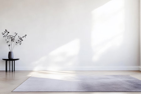 Sunlight streams into a minimalist room, illuminating a soft rug and a small table with a stylish vase containing leafy branches. The calm ambiance invites relaxation and peace.の素材