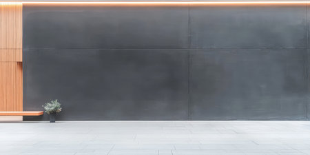 A sleek, contemporary space features a dark wall and wooden accents. A small plant stands in a simple pot, adding a touch of nature to the urban environment.の素材