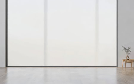 A spacious room features expansive windows that allow ample natural light to flood in, showcasing a simple design with a wooden chair and a small plant on the floor.の素材