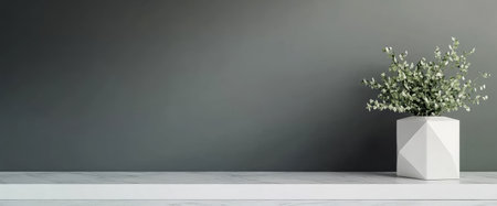 A minimalistic interior showcases a geometric white planter holding lush greenery against a dark wall. The clean lines and neutral tones create a calming atmosphere in the space.の素材