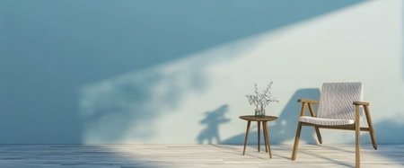 A cozy seating area features a wooden chair with striped fabric and a small round table. Sunlight casts shadows on the light blue wall, enhancing the serene atmosphere.の素材