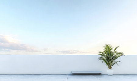 A tranquil roof terrace features a minimalistic design with a grey bench and a potted palm. The sky transitions to soft colors as the sun sets, creating a peaceful atmosphere.の素材