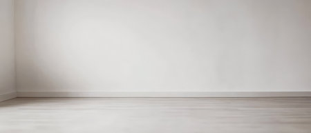 A spacious room features white walls and natural wooden flooring. The minimalistic design creates a sense of calm and openness perfect for various uses.の素材