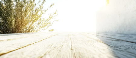 Warm sunlight filters across a wooden deck highlighting the natural textures. Nearby green plants sway gently in the breeze. The scene embodies tranquility and invites relaxation.の素材