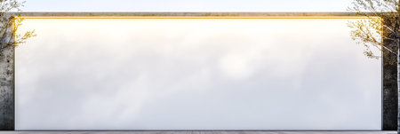 A spacious blank wall made of concrete stands in an outdoor area bathed in soft sunlight. Low greenery frames the scene creating a calm and minimalist atmosphere.の素材