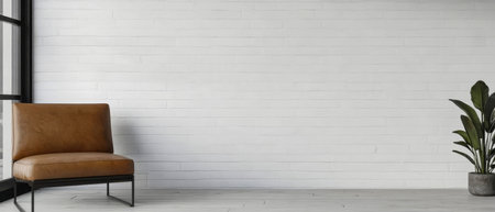 A modern chair in warm leather tones is positioned against a minimalist white wall. A tall potted plant adds a touch of greenery complementing the serene and spacious environment.の素材