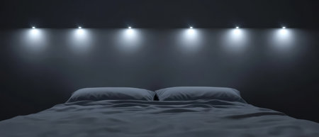 The room features a simple yet elegant design with a neatly made bed topped with light-colored bedding. Soft lighting from the wall above creates a serene atmosphere in the nighttime setting.の素材