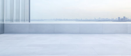 A spacious and minimalistic rooftop terrace features clean lines and pale stone flooring. The skyline stretches in the background reflecting dusk hues over the water.の素材