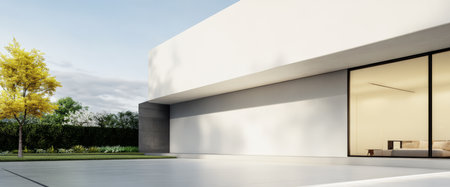 A sleek modern structure with large glass windows sits in a lush green landscape. The light-colored building contrasts with the vibrant tree and open sky reflecting tranquility.の素材