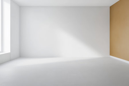 A clean minimalist interior space features a large window allowing natural light to fill the room. The walls are painted white and light brown creating a warm and inviting atmosphere.の素材