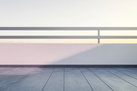 A serene balcony featuring a sleek white wall and wooden flooring bathed in soft hues of dawn light. The tranquil atmosphere invites relaxation as the day begins.の素材
