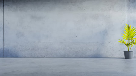 A contemporary indoor area showcases a simple potted plant set against a smooth concrete wall. The minimalist design creates a calm atmosphere for relaxation or creativity.の素材