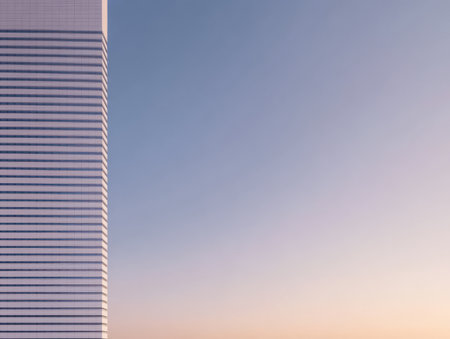 A striking skyscraper with sleek design stands prominently against a soft pastel sky during sunset. The colors blend beautifully creating a serene atmosphere in the city.の素材