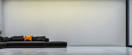 A sleek couch with a vibrant orange pillow is positioned against a plain wall in a spacious modern interior.の素材