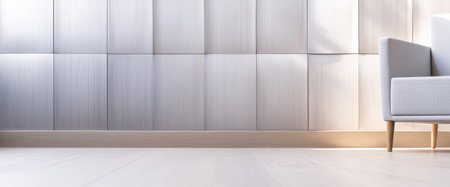 A spacious area showcases a light-colored textured wall and a contemporary armchair positioned gracefully. Natural light brightens the room enhancing the elegant atmosphere.の素材