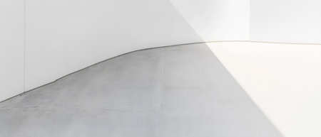 A minimalist interior showcases a curved wall and floor illuminated by natural light. The white surfaces create a serene atmosphere emphasizing the fluidity of the design.の素材