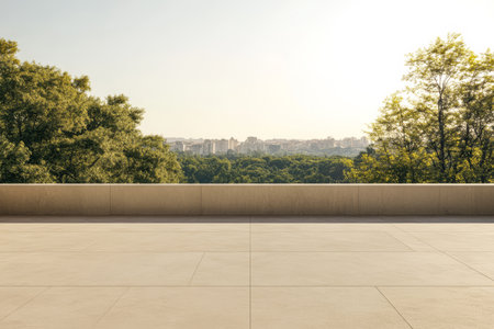 A spacious terrace overlooks a lush green landscape and city skyline at sunset. The warm sunlight casts a golden hue creating a peaceful atmosphere perfect for relaxation.の素材