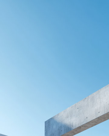 A sleek concrete structure stretches across the frame contrasting with a vibrant blue sky. The minimalist design highlights contemporary architecture in an open urban environment.の素材