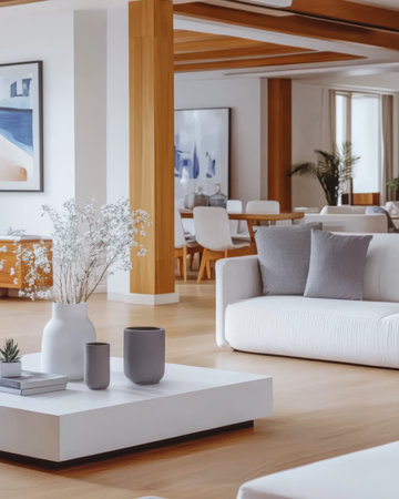 This cozy living area features elegant white sofas wooden accents and stylish decor. Natural light floods the space creating a welcoming atmosphere for relaxation and social gatherings.の素材