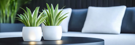 Two sleek white planters hold green plants on a black coffee table in a stylish modern living room setting. Soft pillows are arranged on a light grey sofa enhancing the chic decor.の素材