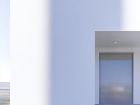 A stylish entrance showcases a contemporary door framed by minimalistic white walls. Bright sunlight casts soft shadows enhancing the modern aesthetic of the property.の素材