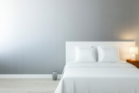 A calming bedroom showcases a white bed with two pillows sleek side tables and a soft lamp casting warm light. The textured wall creates a serene atmosphere ideal for relaxation.の素材