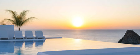 The sun sets gracefully over the calm ocean waters illuminating the sky with warm hues. A tranquil infinity pool accompanied by lounge chairs offers a perfect view of the paradise.の素材