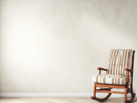 A classic wooden rocking chair with striped upholstery stands alone against a soft neutral wall. This serene room exudes tranquility and comfort inviting rest and relaxation.の素材