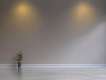 A minimalist interior space features a single potted plant on a polished floor. Soft lighting from wall fixtures creates a warm inviting atmosphere highlighting the simplicity of the decor.の素材