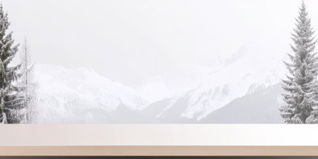 Snow blankets the mountains in a tranquil winter landscape. Tall evergreen trees frame the scene creating a peaceful picturesque view during the snowy season.の素材